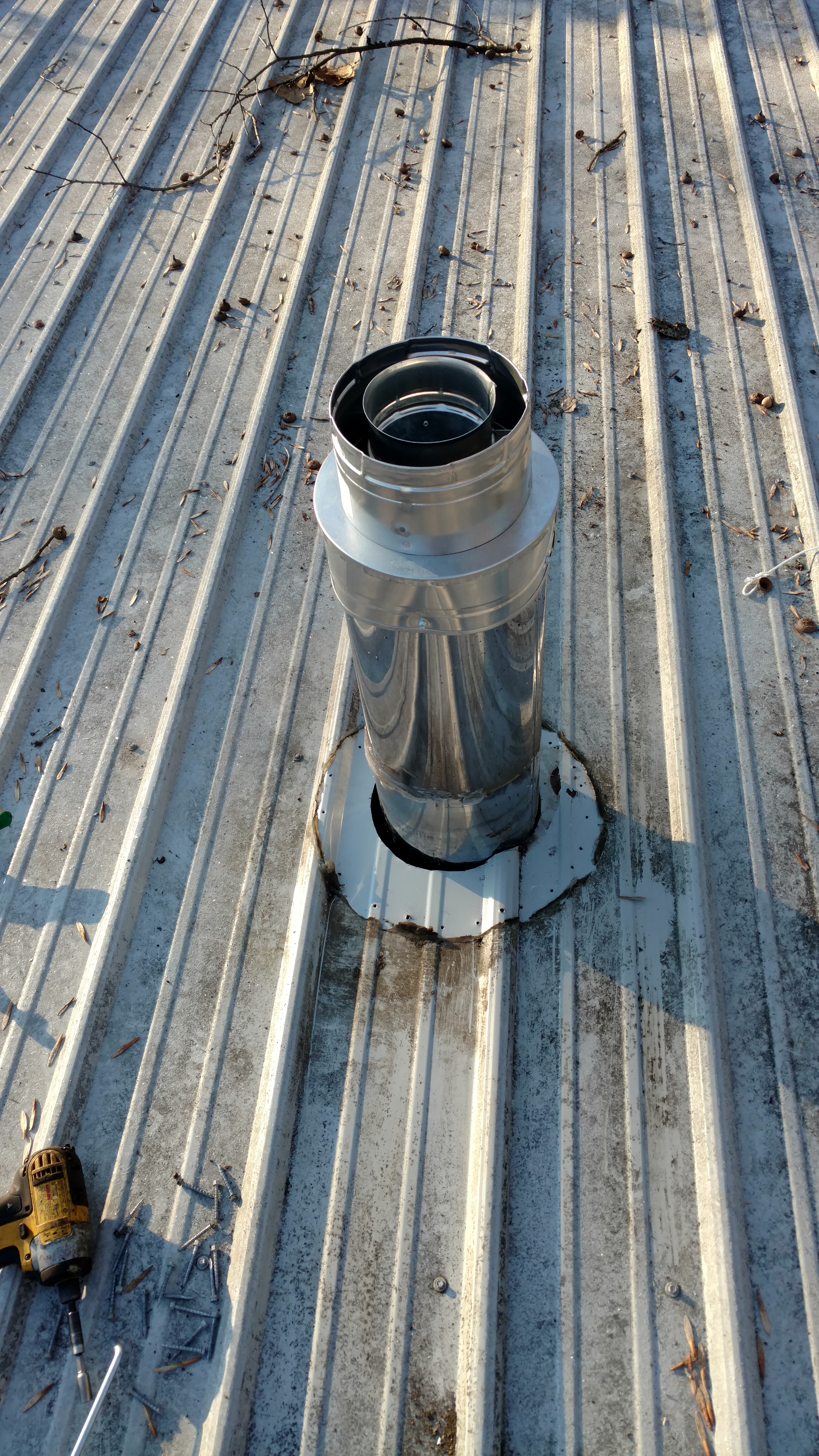 Installing A Wood Stove Chimney Through A Metal Roof 