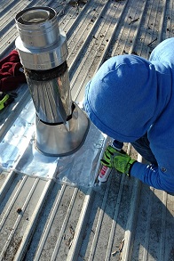 Installing A Wood Stove Chimney Through A Metal Roof 